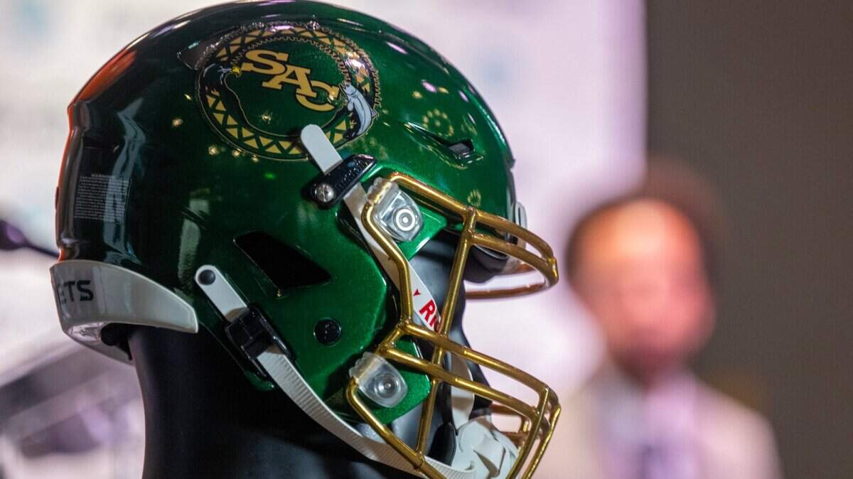 A Sacramento State football helmet, featuring tribal designs to acknowledge Native American history and culture, is displayed at press conference at Sky River Casino in Elk Grove on Friday, Nov. 22, 2024. The Wilton Rancheria tribe, which owns the casino, and the university announced multiyear partnership at the event.